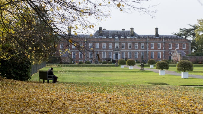 A visitor enjoying the autumn views of Erddig Hall